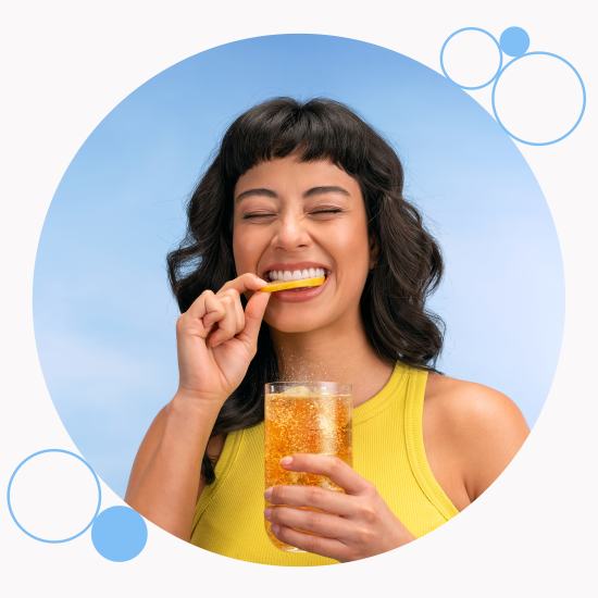 A woman drinking a homemade sparkling drink